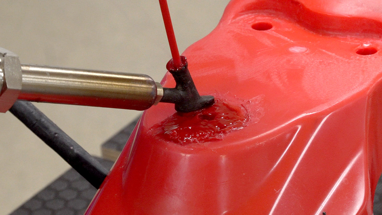Two airless plastic welders, one with a tube welding tip and the other with a flat welding tip