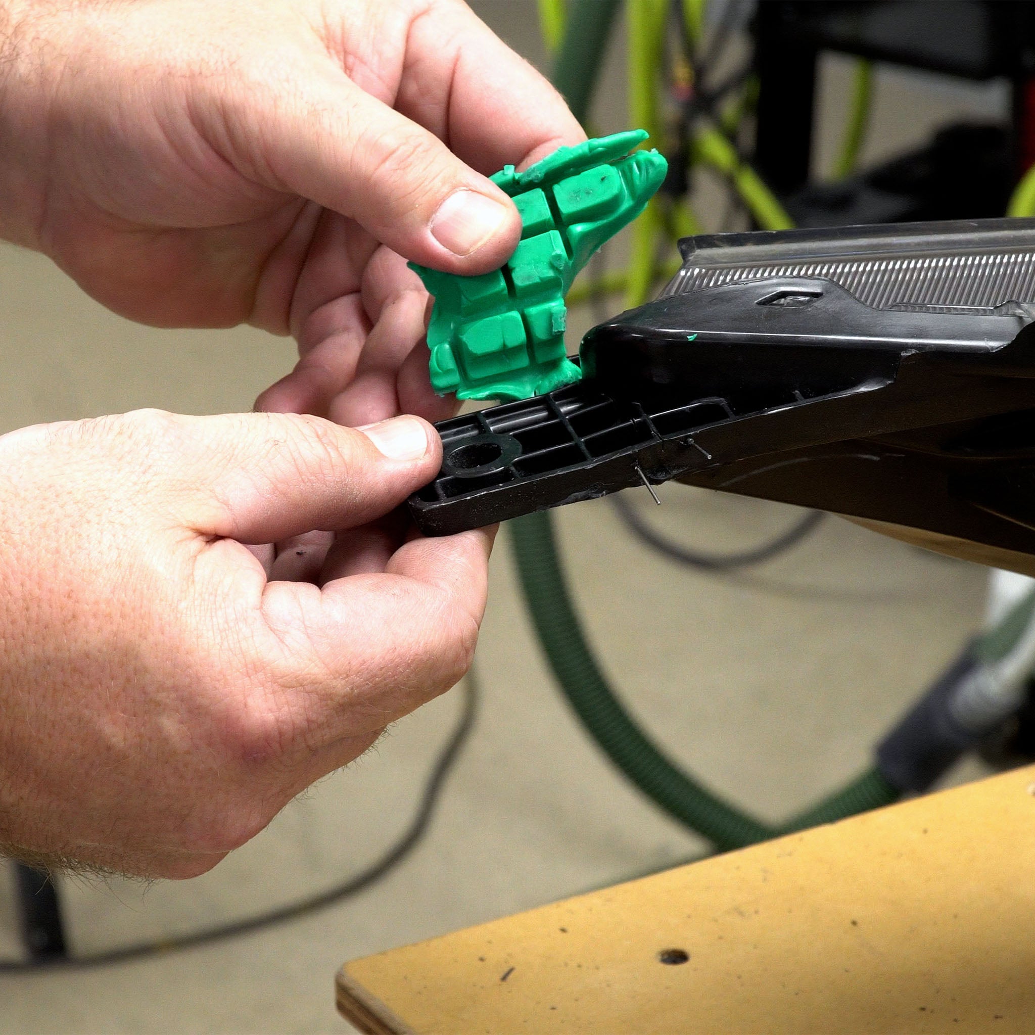 An impression of a headlight tab formed into the putty