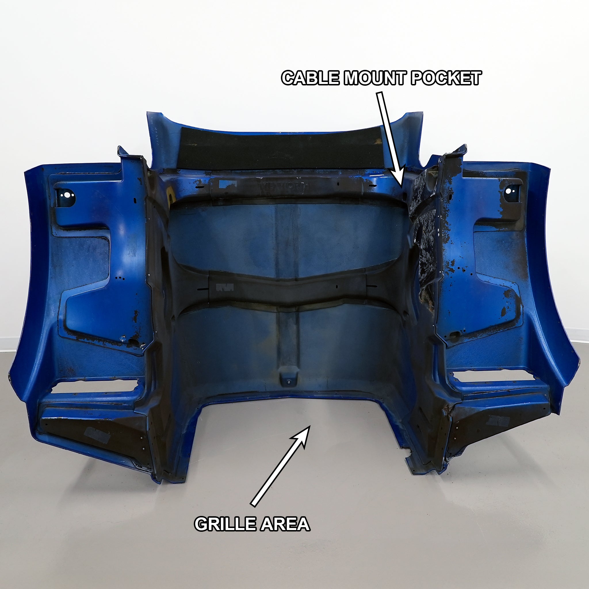 The Kenworth hood with the grille area and cable mount pocket labeled