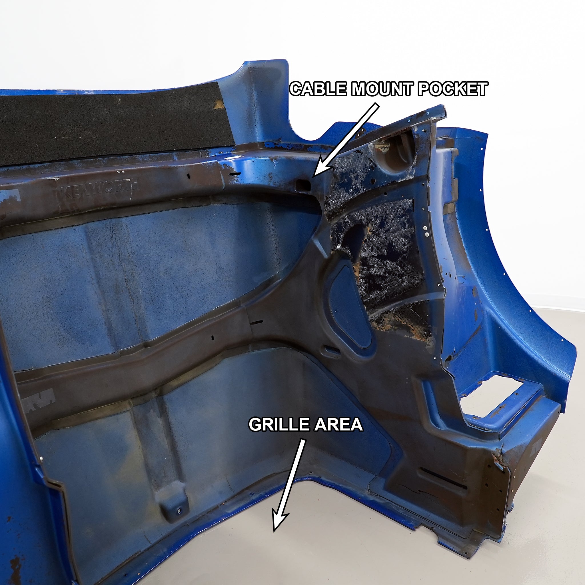 The Kenworth hood with the grille area and cable mount pocket labeled, from the side