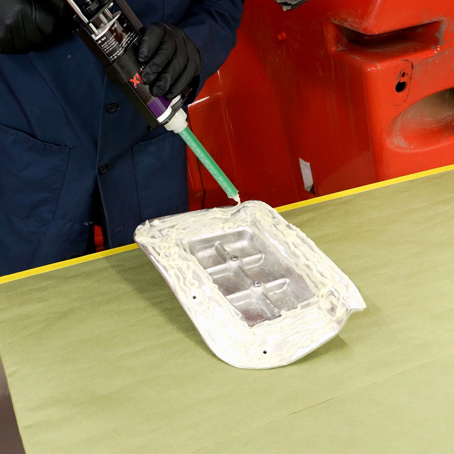 Applying PlastiFix adhesive to the casting