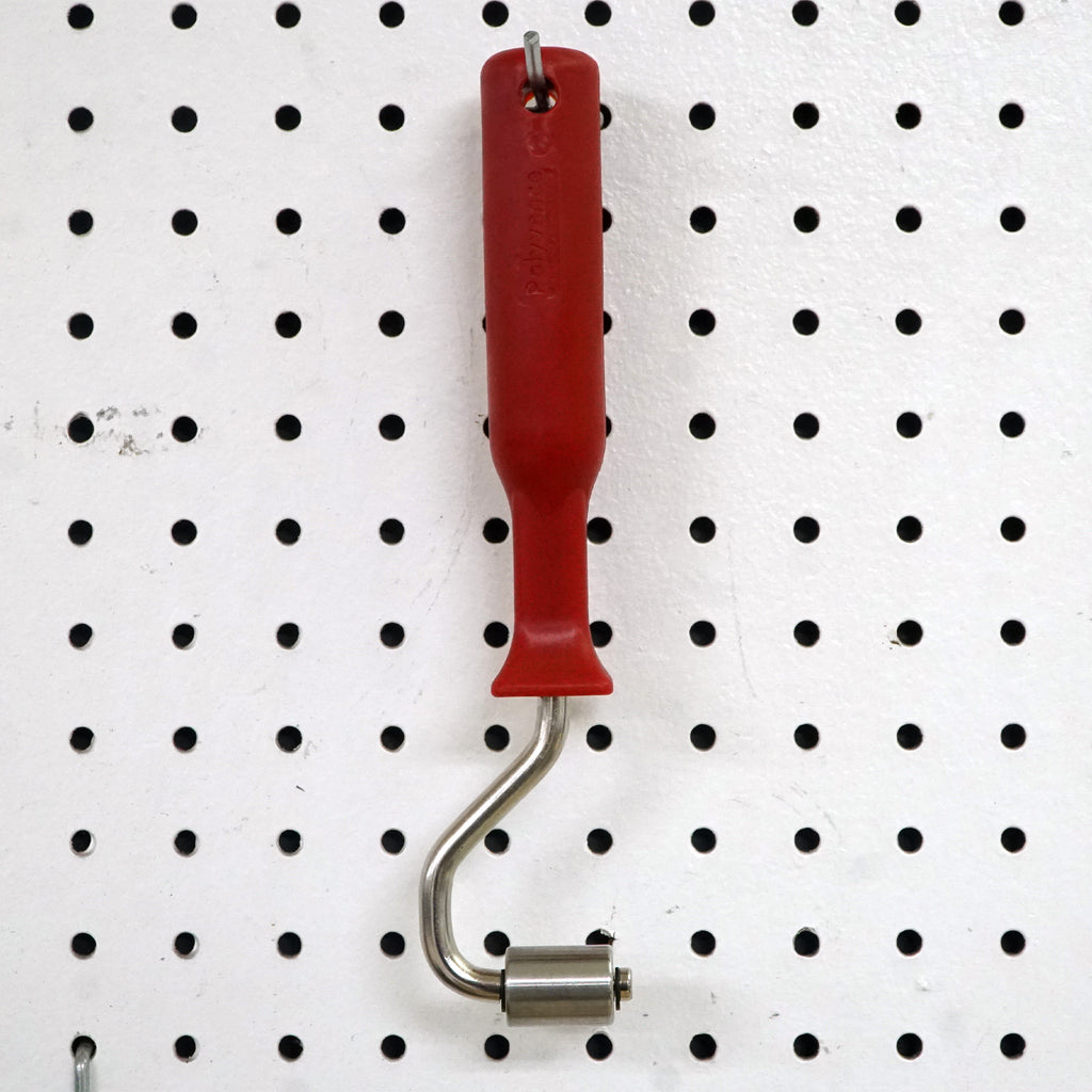 Compression Roller hanging on a pegboard