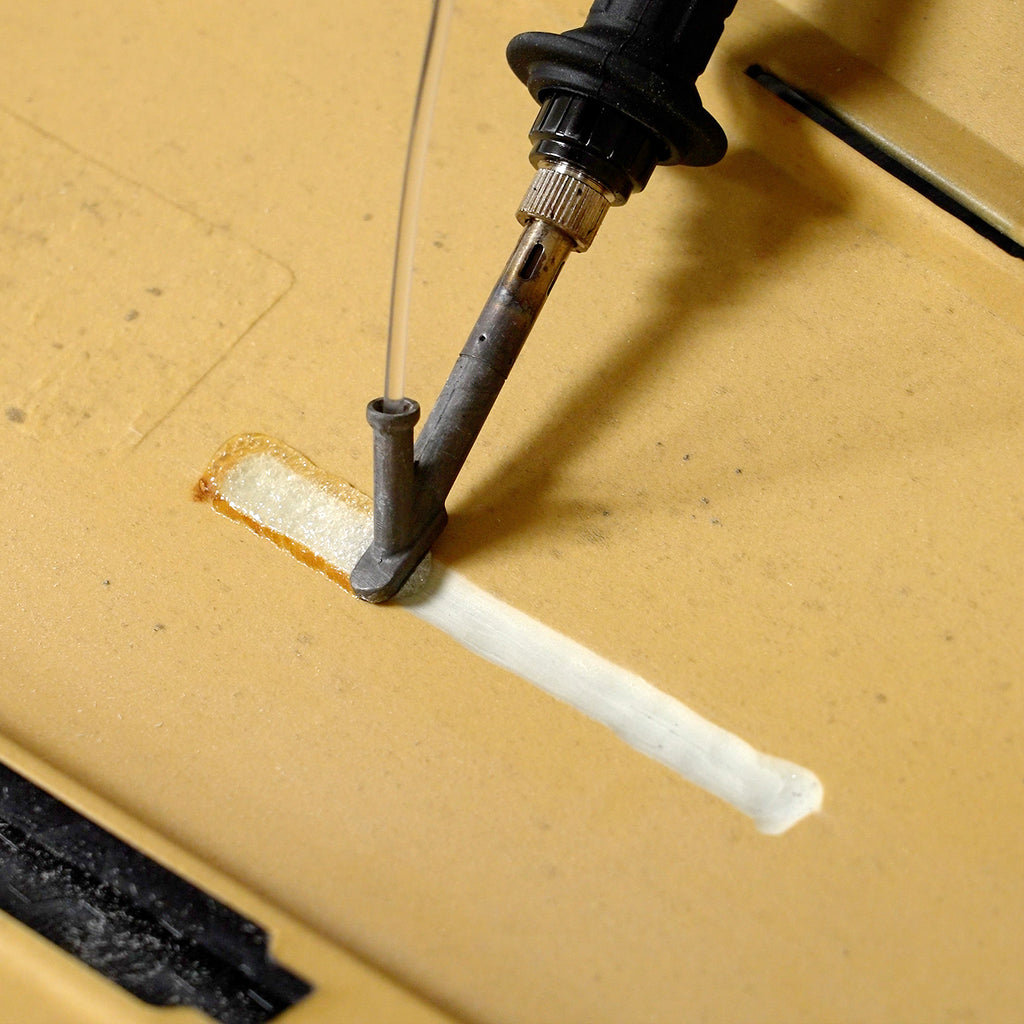 A polyurethane bumper cover is being repaired with the airless plastic welder and polyurethane welding rod