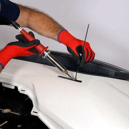 A bumper cover is being welded with the nitrogen plastic welder and polypropylene welding rod
