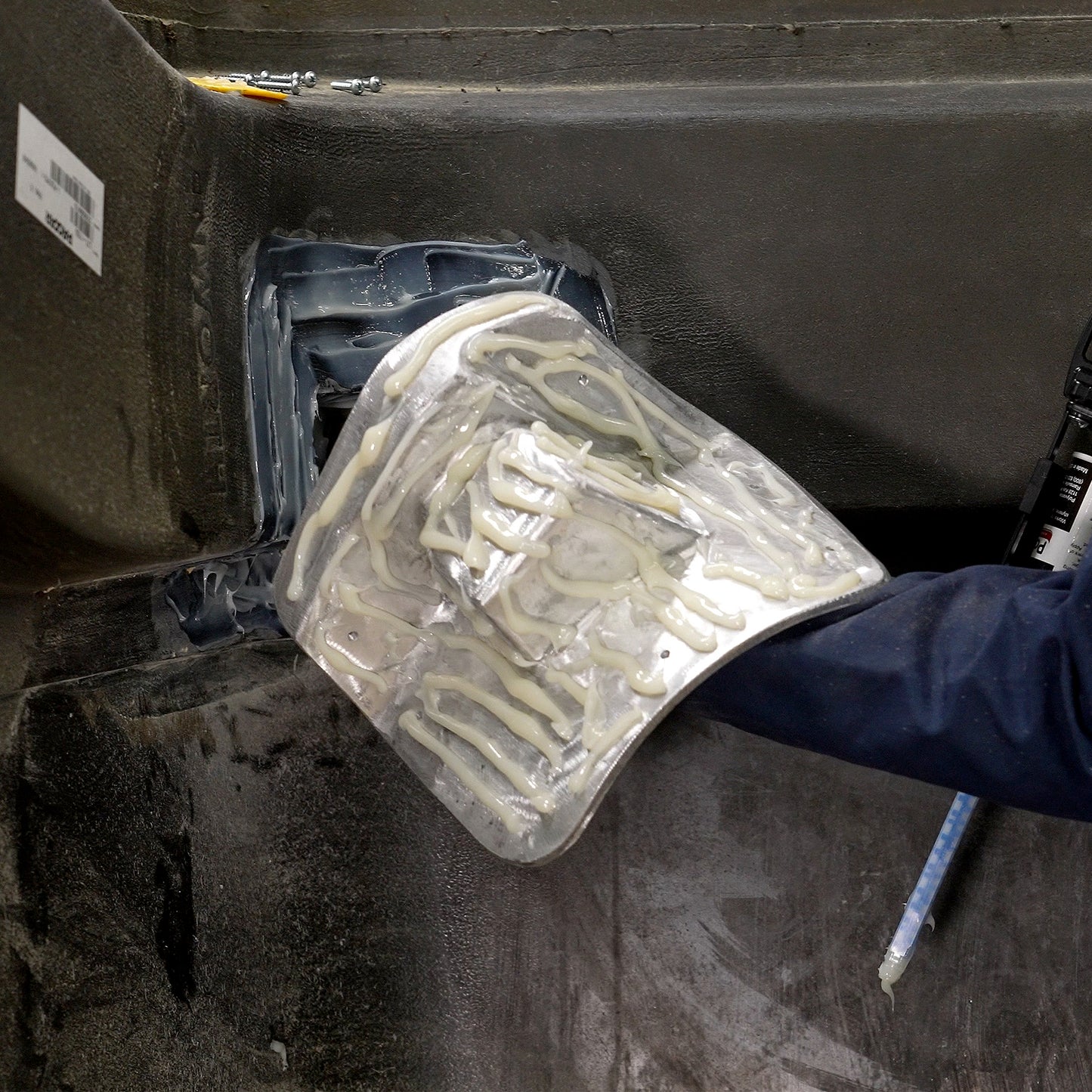 Applying the PlastiFix adhesive to the aluminum casting