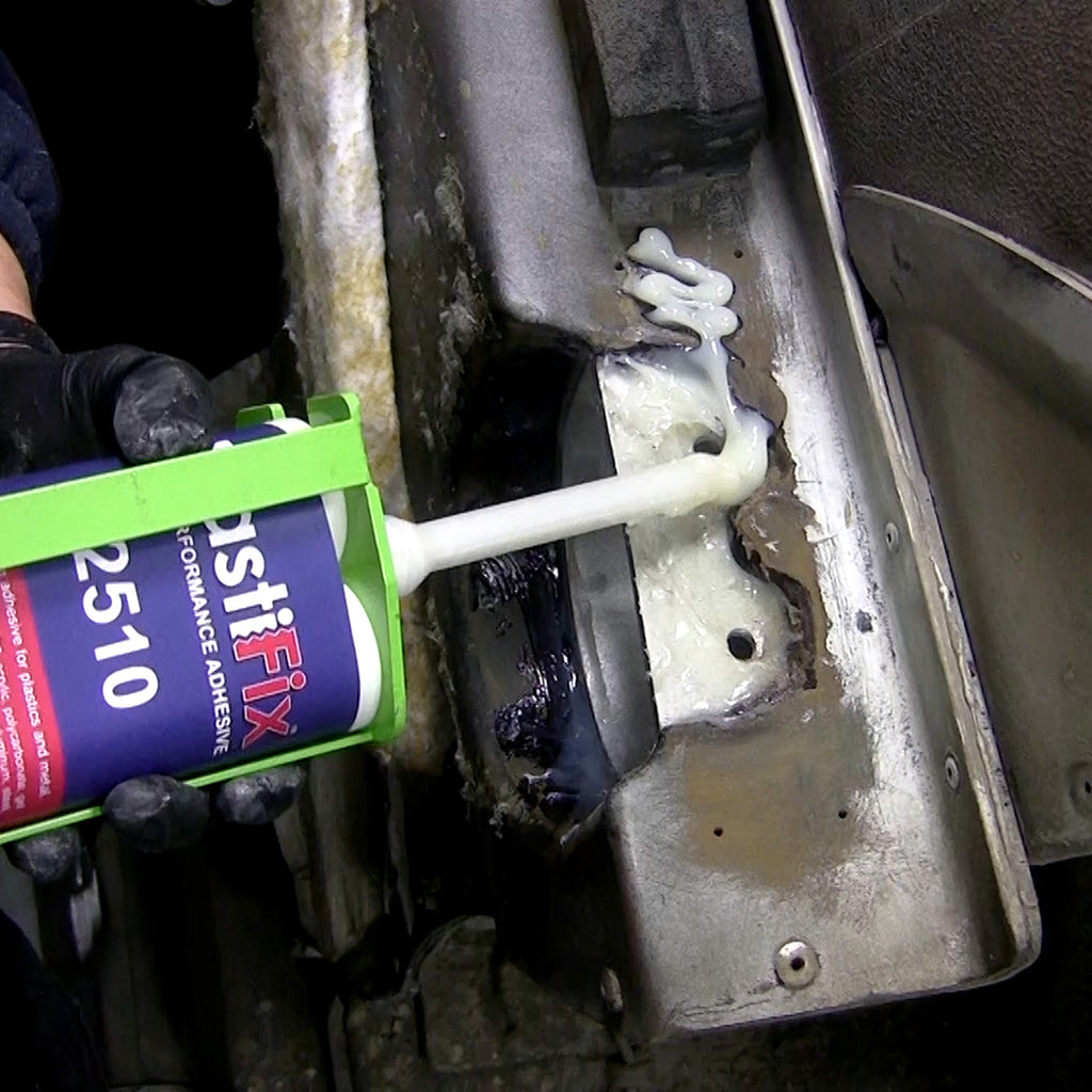 Applying PlastiFix over the plug and sanded area of the hood