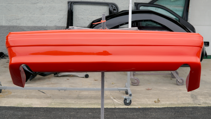 The 1993 Ford Mustang Cobra rear bumper after being painted its original color.