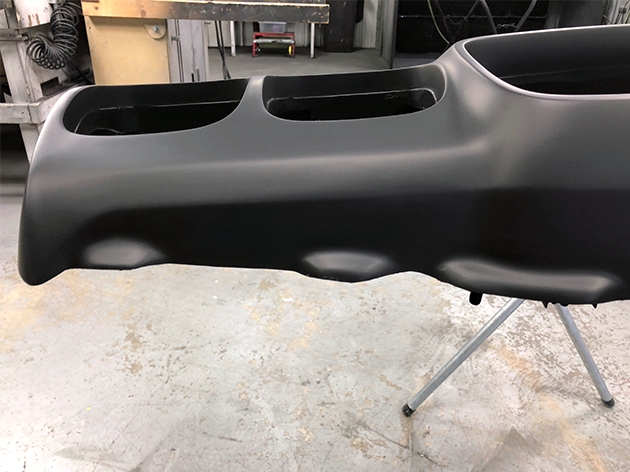 The bumper after being repaired and primed.