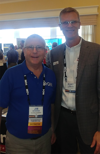 Jim Outwater and Kurt Lammon smiling and posing for a photo