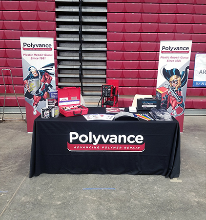 The Polyvance booth displaying a variety of plastic repair and refinishing products.