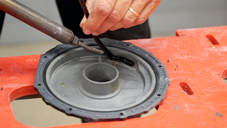 Using a corner welding rod and nitrogen plastic welder to weld the crack on the backside.