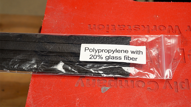 Black welding rod. The label says it is polypropylene with 20% glass fiber