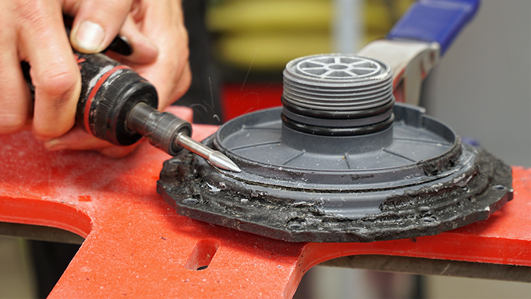 Using a die grinder to v-groove the crack.