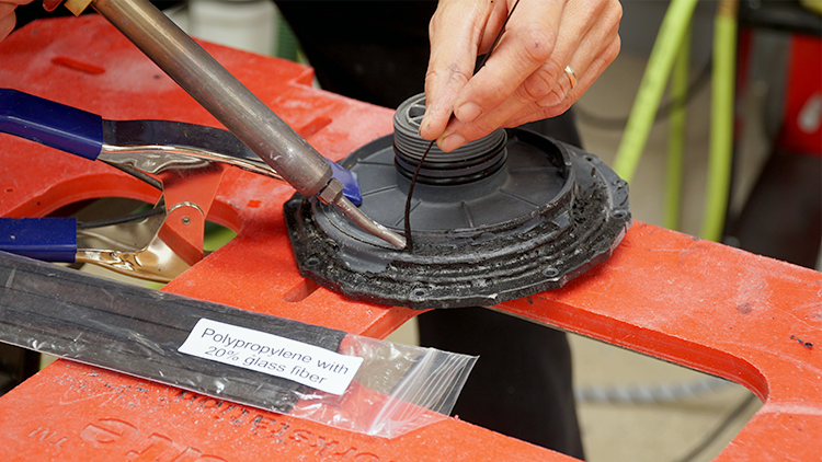 Using a welding rod and nitrogen plastic welder to weld the crack.