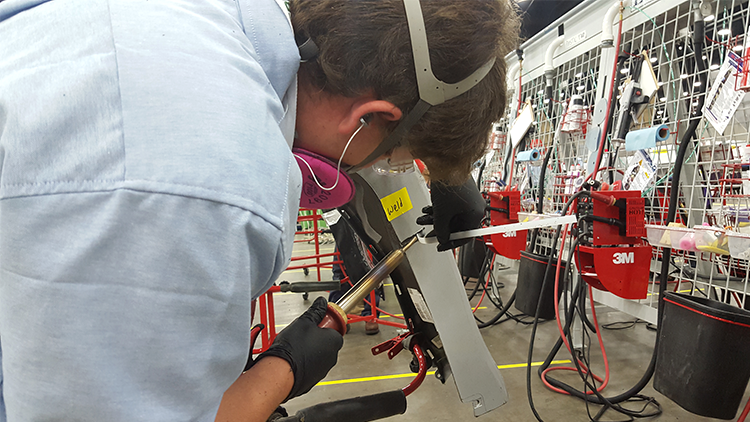 A competitor welding with the nitrogen plastic welder at the 2018 SkillsUSA national competition.