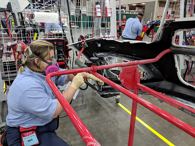 Competitor repairing plastic bumper