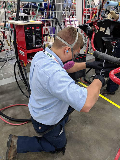 Competitor repairing plastic bumper