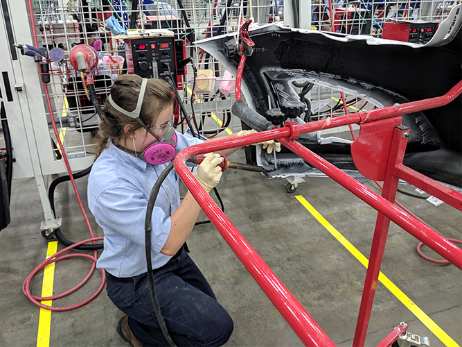 Competitor repairing plastic bumper