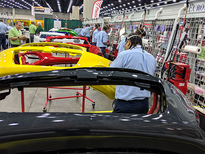 Competitors repairing plastic bumpers.