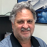 Joe Pellegrino standing in front of Virgil's Auto Body and Paint